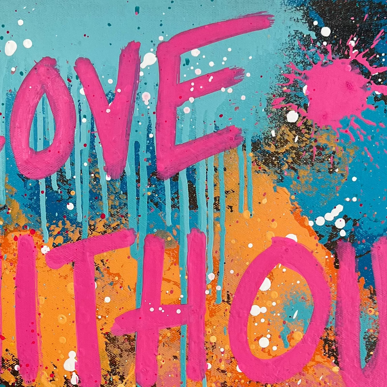Colorful abstract painting with 'Love Without Limits' text on a white wall