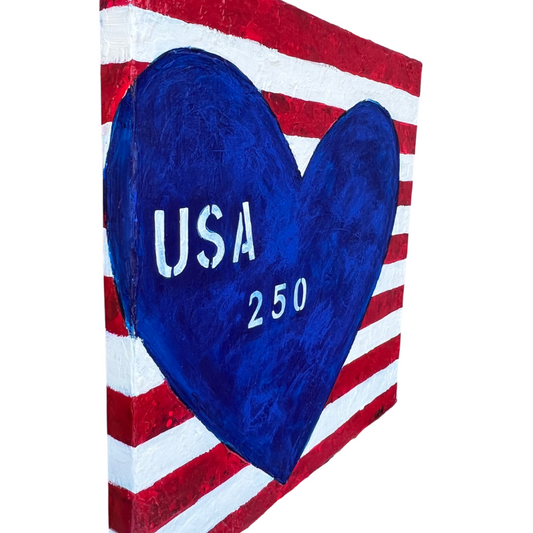Decorative wall art with red, white, and blue colors featuring a heart and 'USA 250' text on a white background.