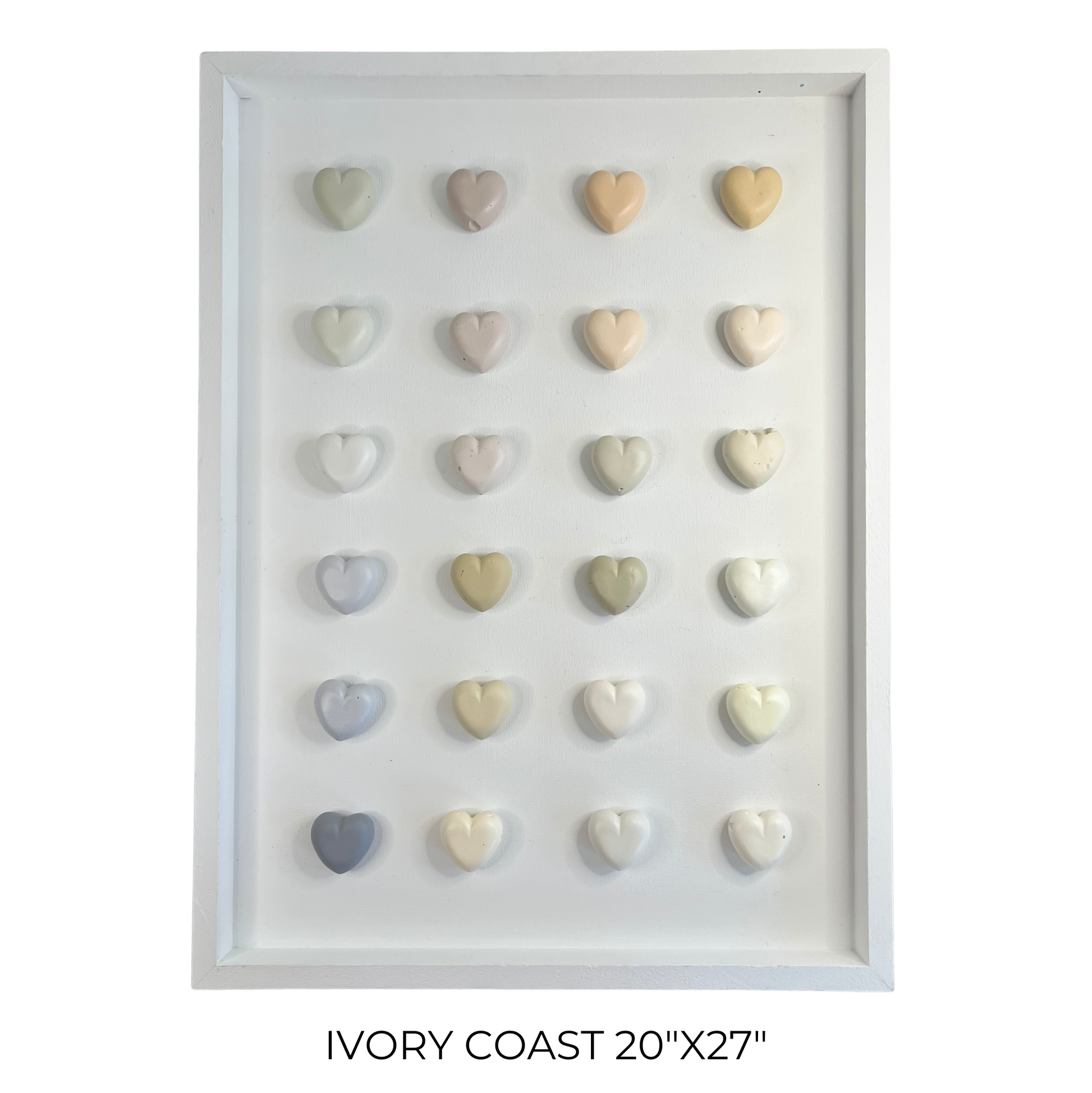 Framed display of heart-shaped objects in various colors on a white background