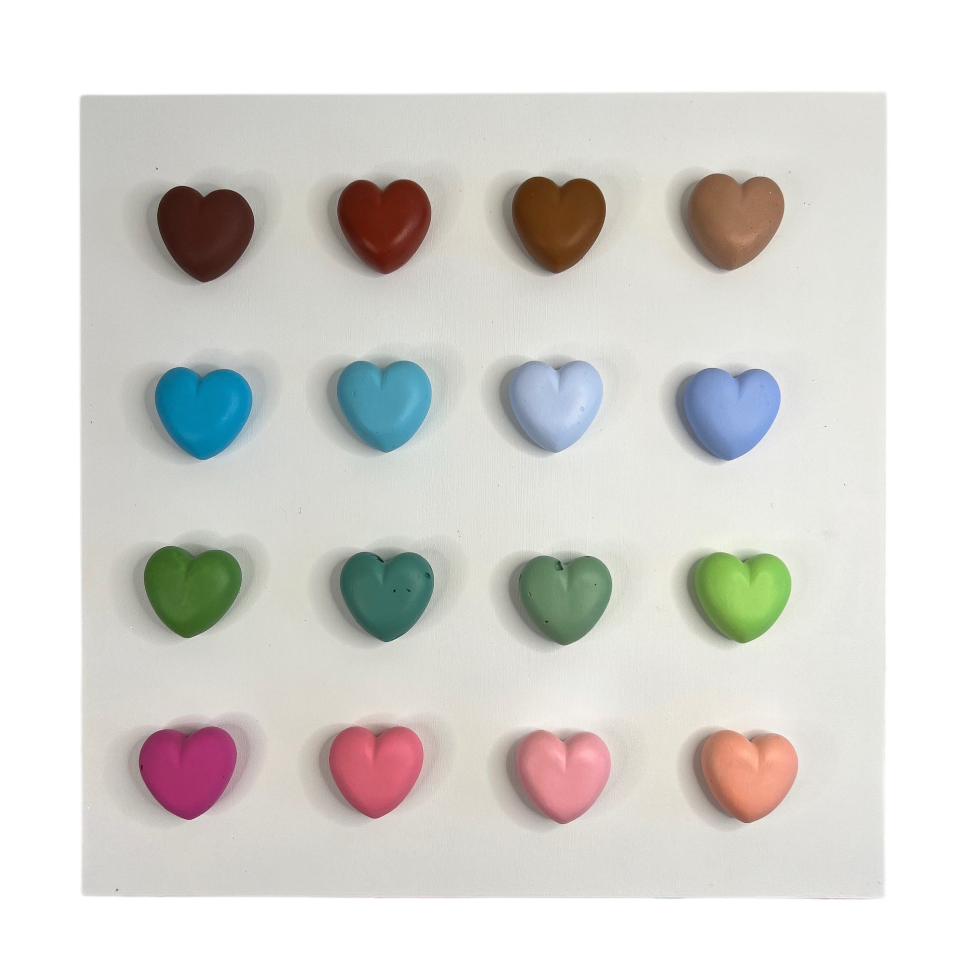Set of colorful heart-shaped candies on a white background