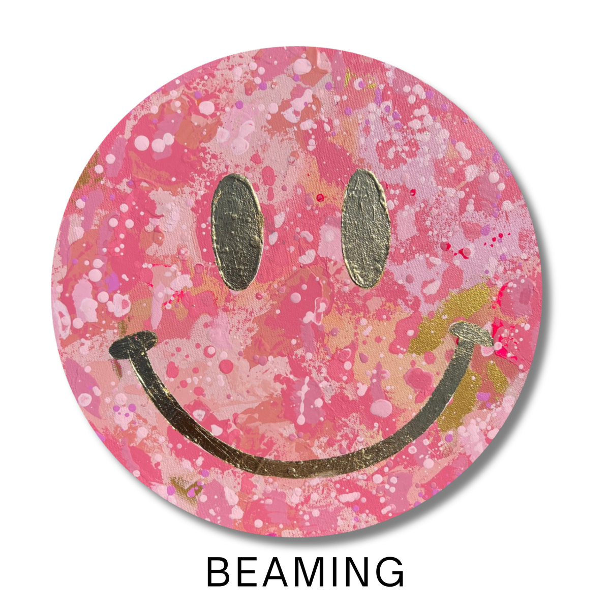 Beaming, a 12-inch round original smiley face painting with layered shades of pink, blush and soft coral acrylic paint, accented with metallic gold and playful splatter details.