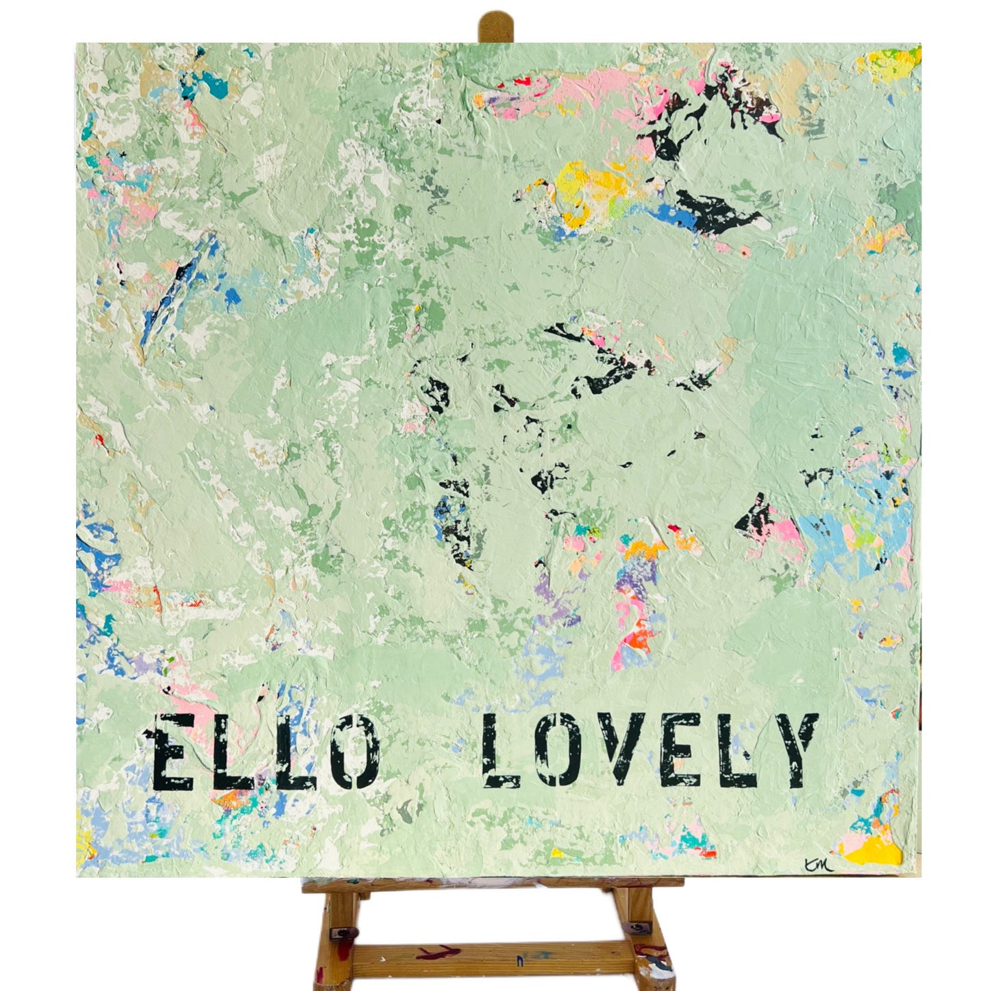 Artistic canvas with 'ELLO LOVELY' text on a green background with abstract patterns.