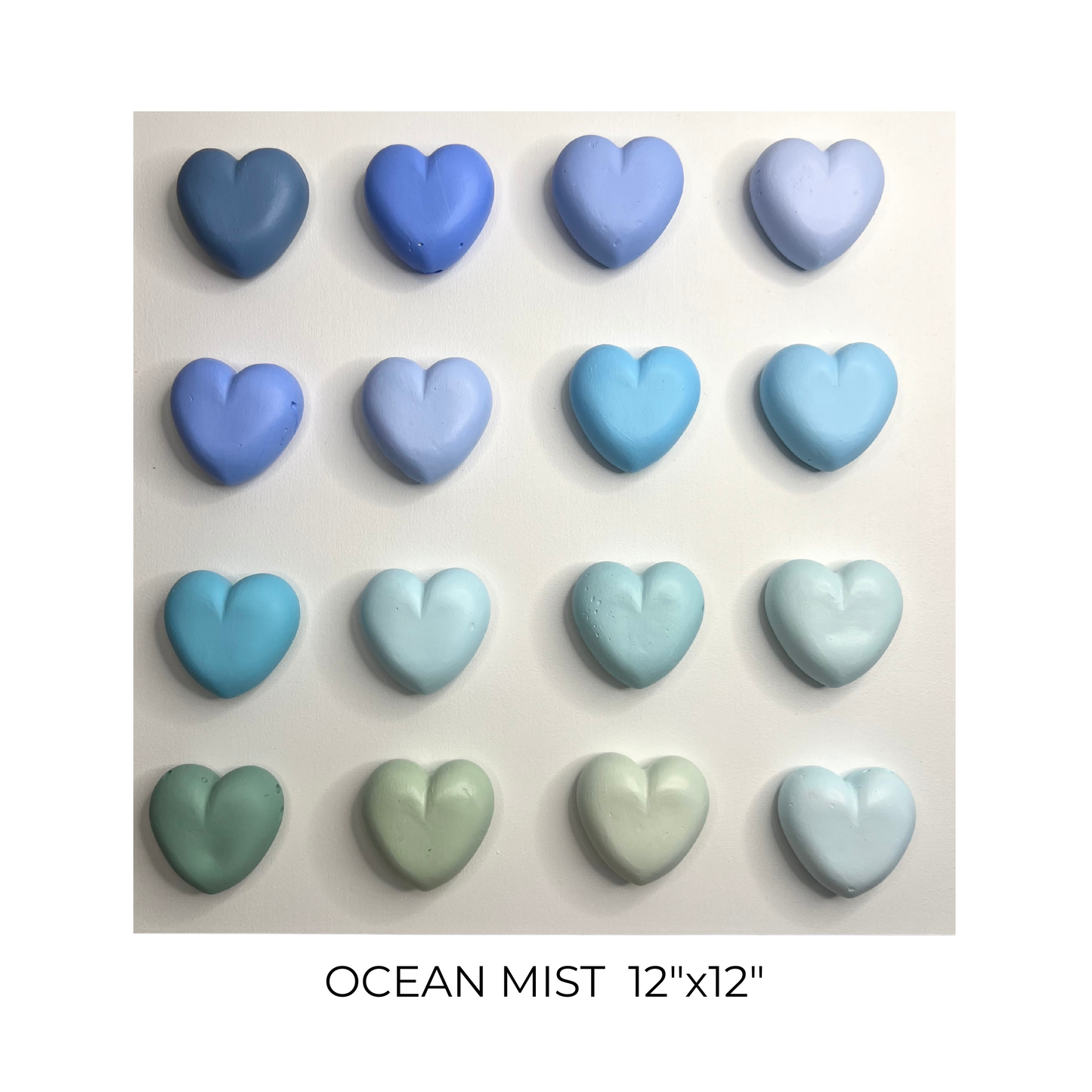 Heart-shaped tiles in various shades of blue and green on a white background, labeled 'Ocean Mist'.