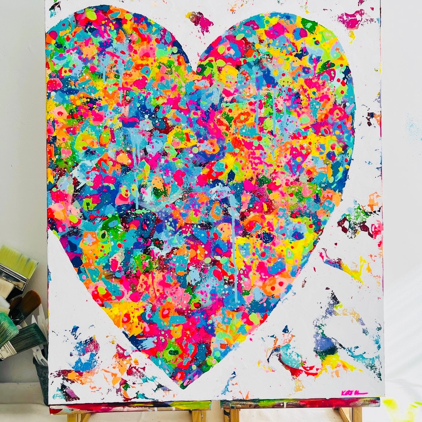 Colorful heart-shaped abstract painting on a white background