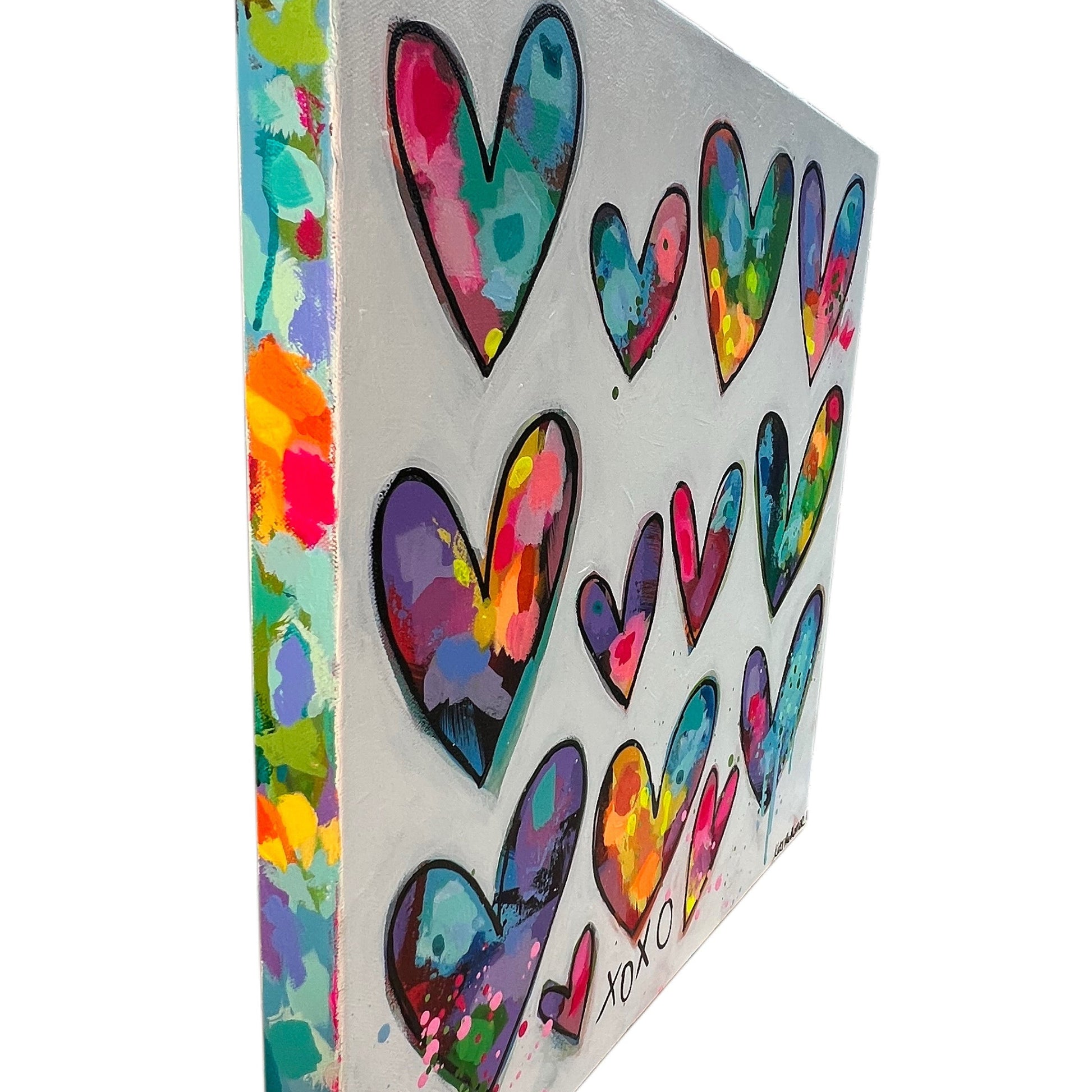 Canvas with colorful heart patterns on a white background
