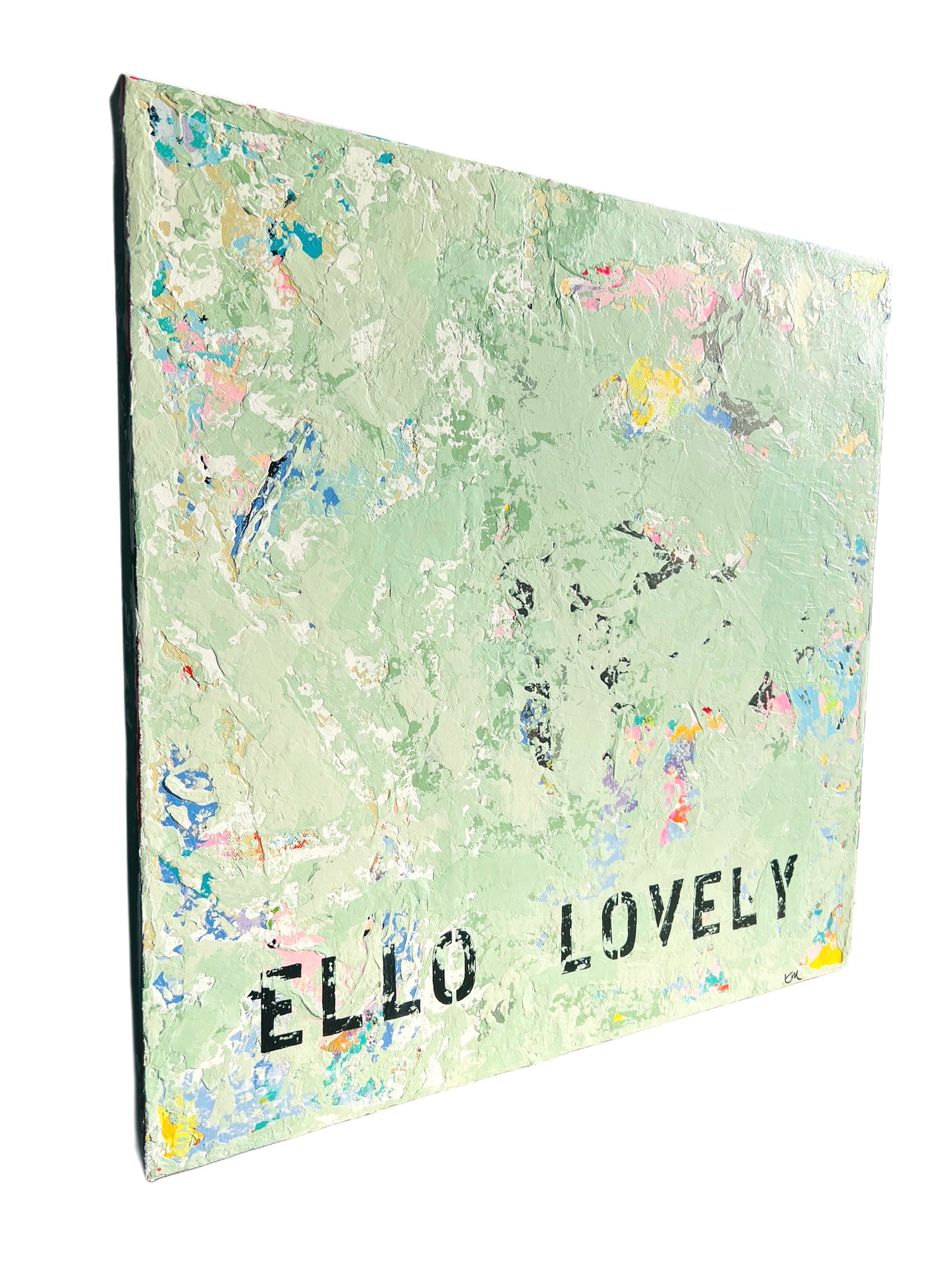 Notebook with floral pattern and 'ELLO LOVELY' text on a white background