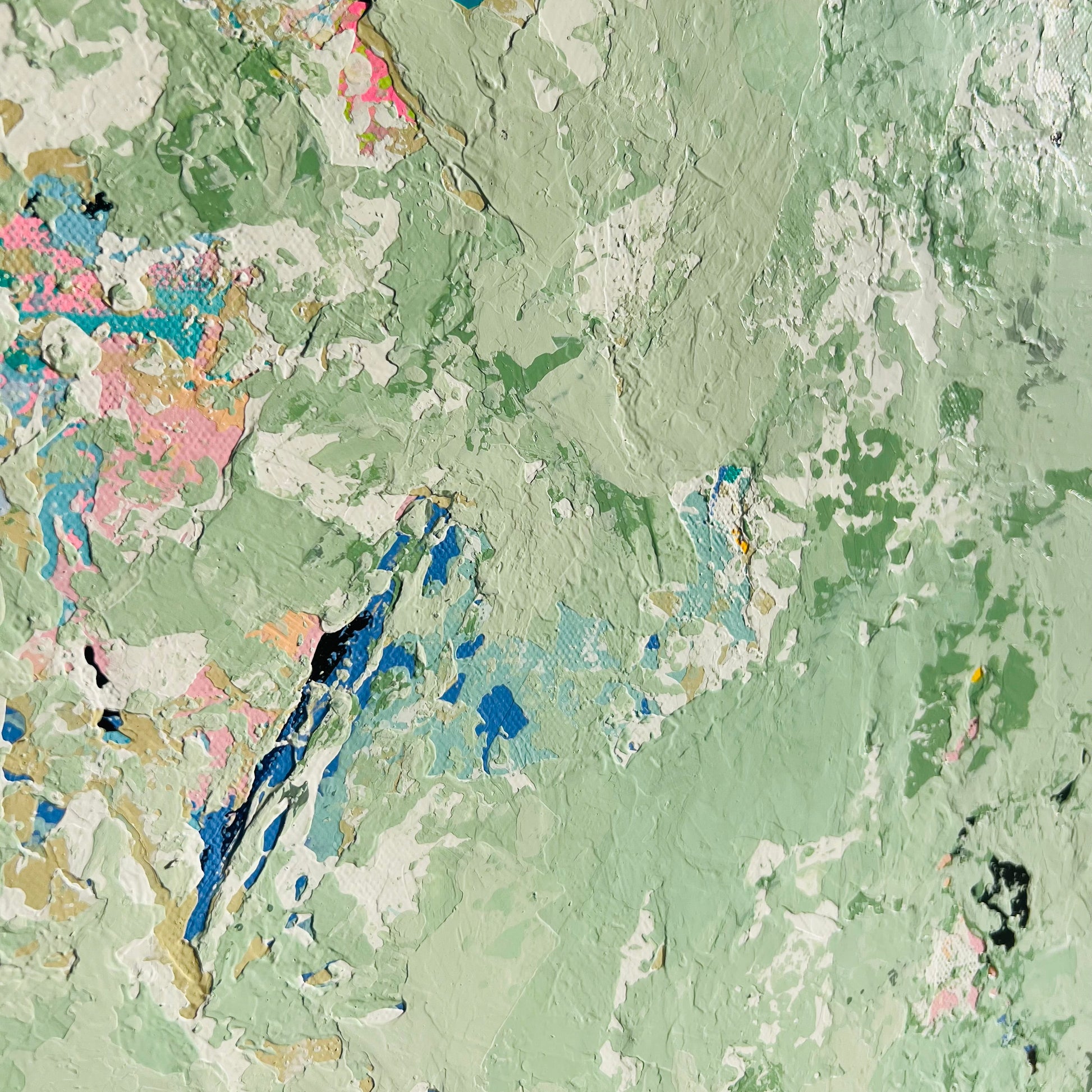 Textured green surface with multicolored patterns