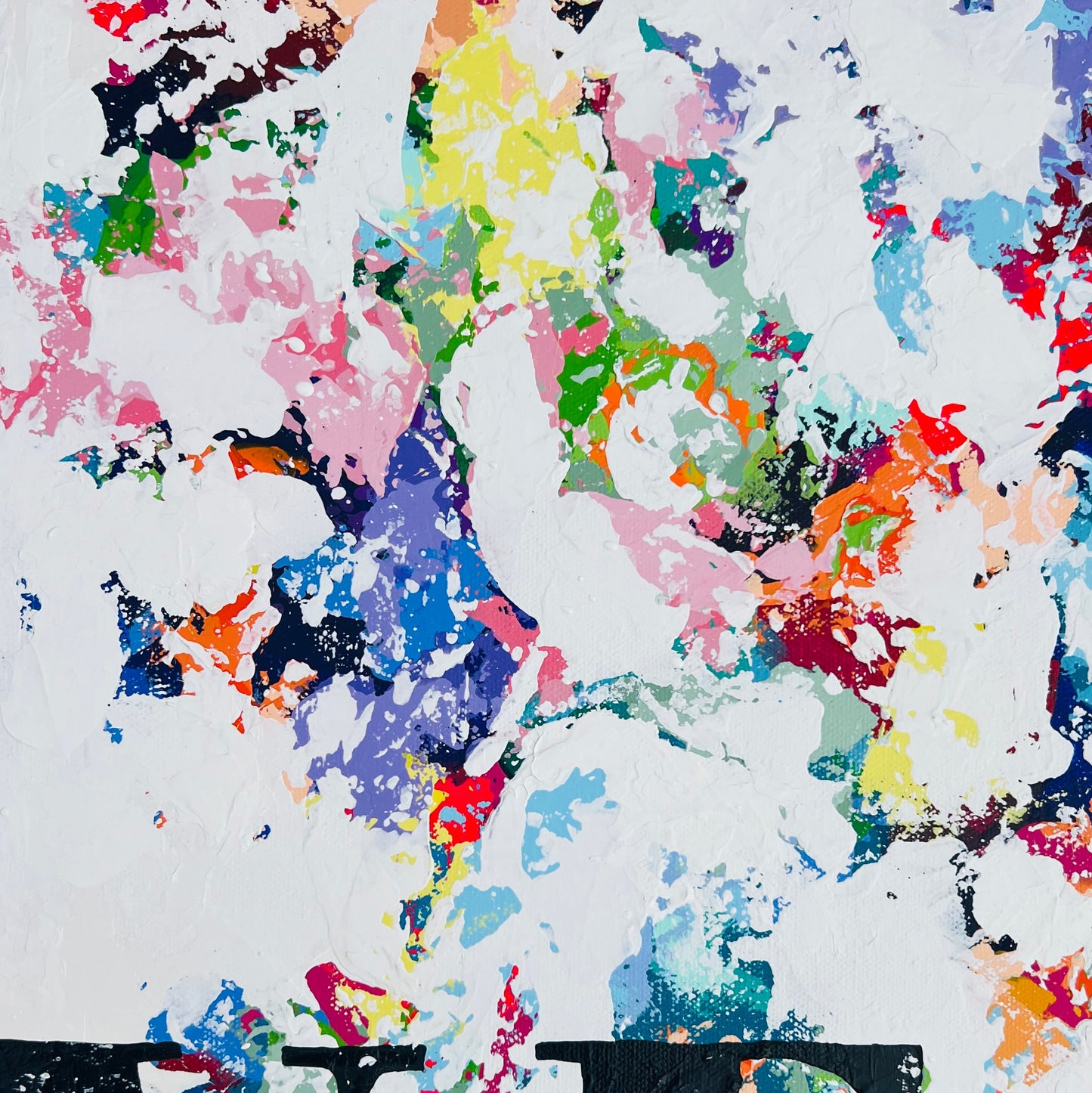 Colorful abstract splatter pattern on a white background