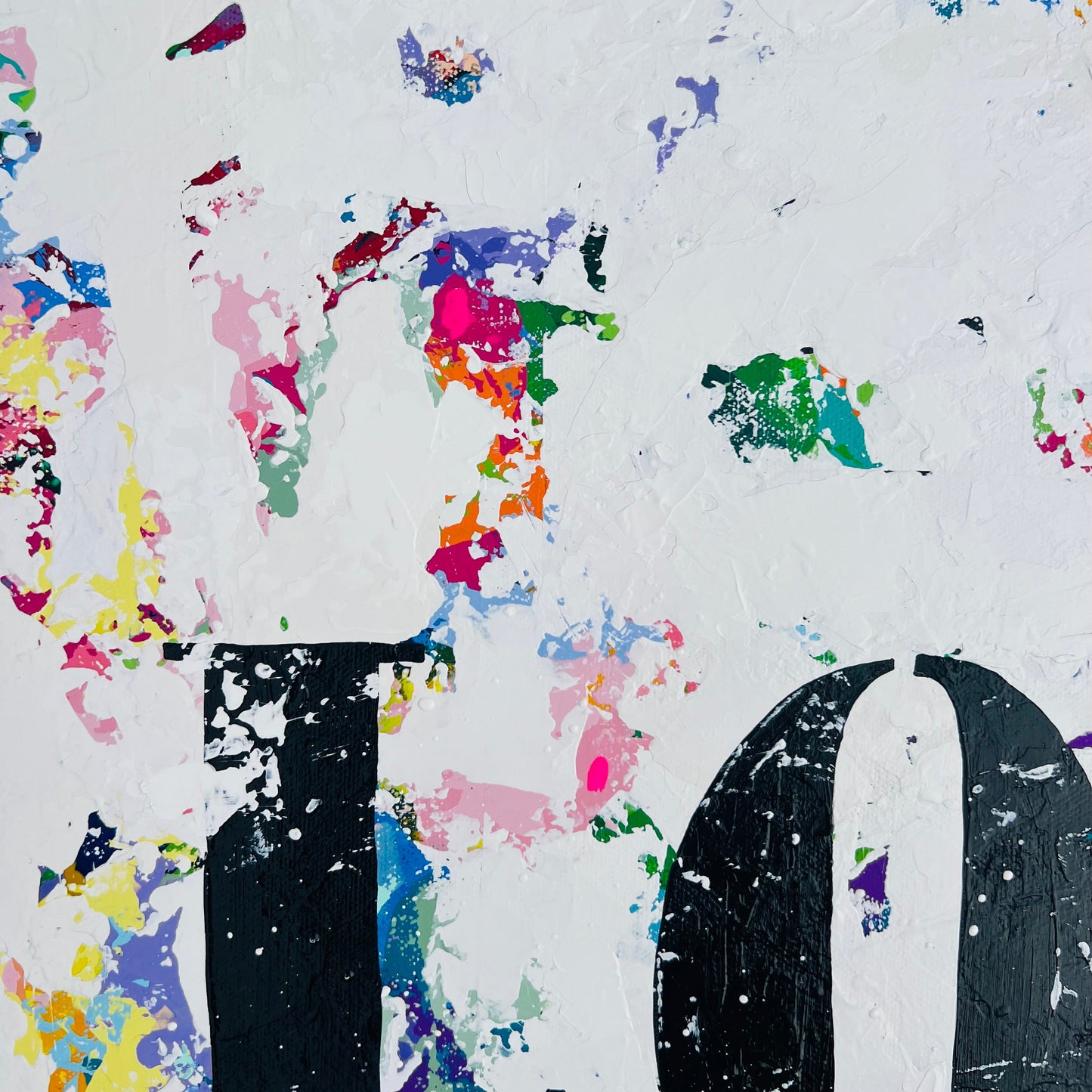 Colorful abstract design with splashes and text on a white background