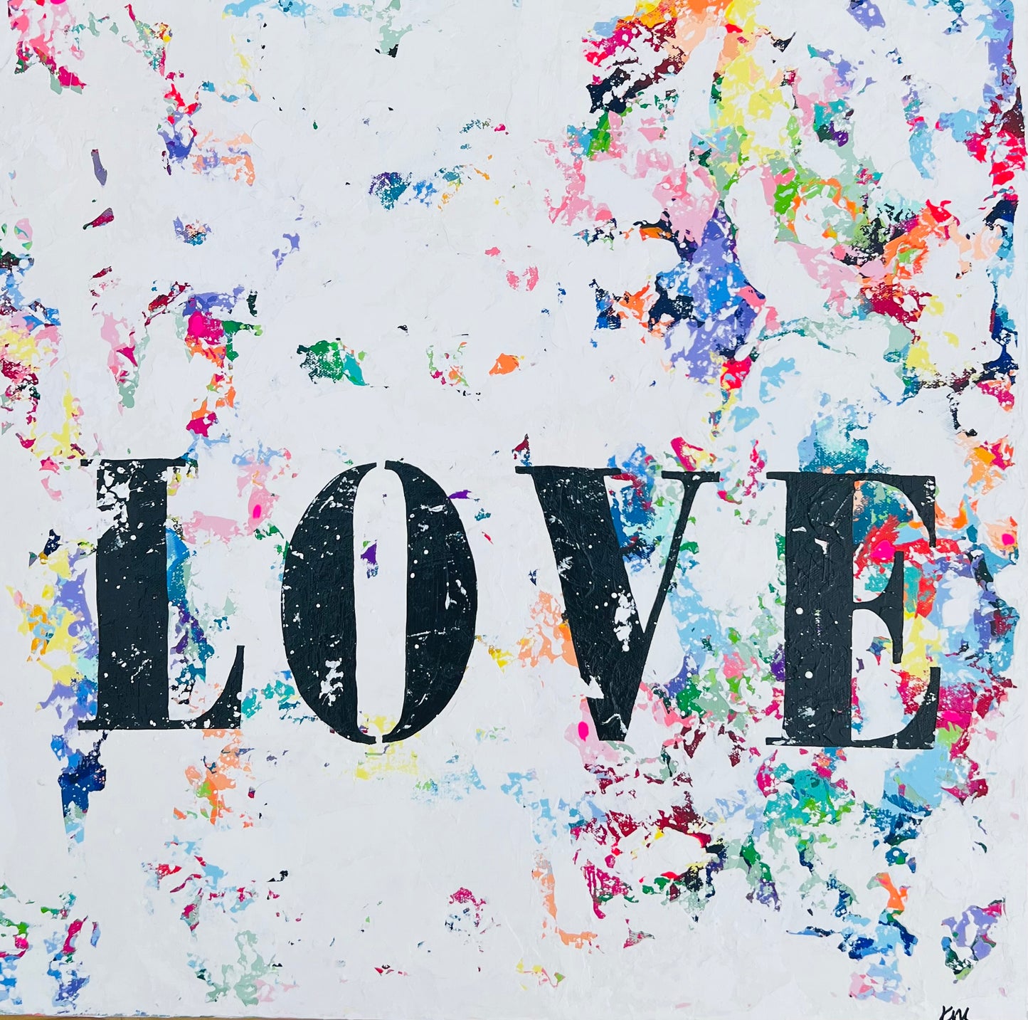 Colorful abstract background with the word 'LOVE' in black letters.