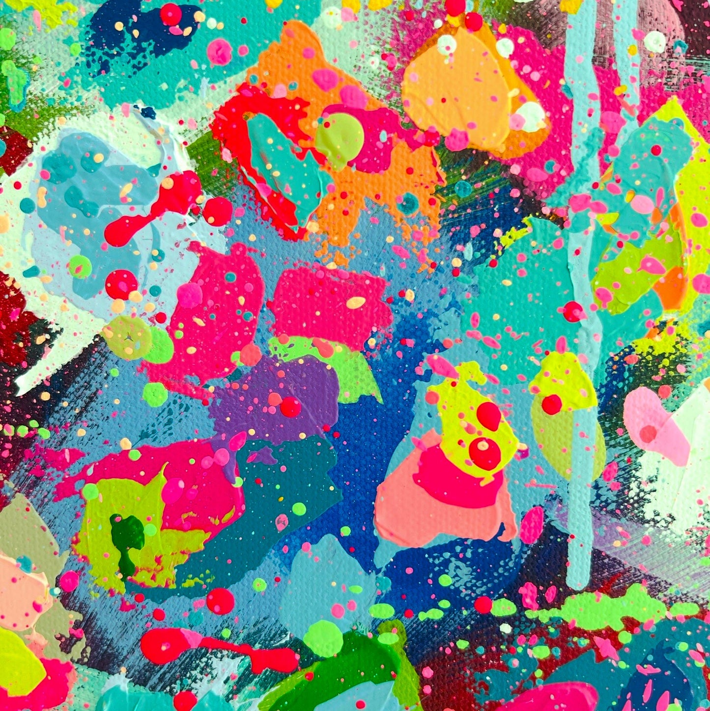 Colorful abstract pattern with splashes of various colors on a dark background