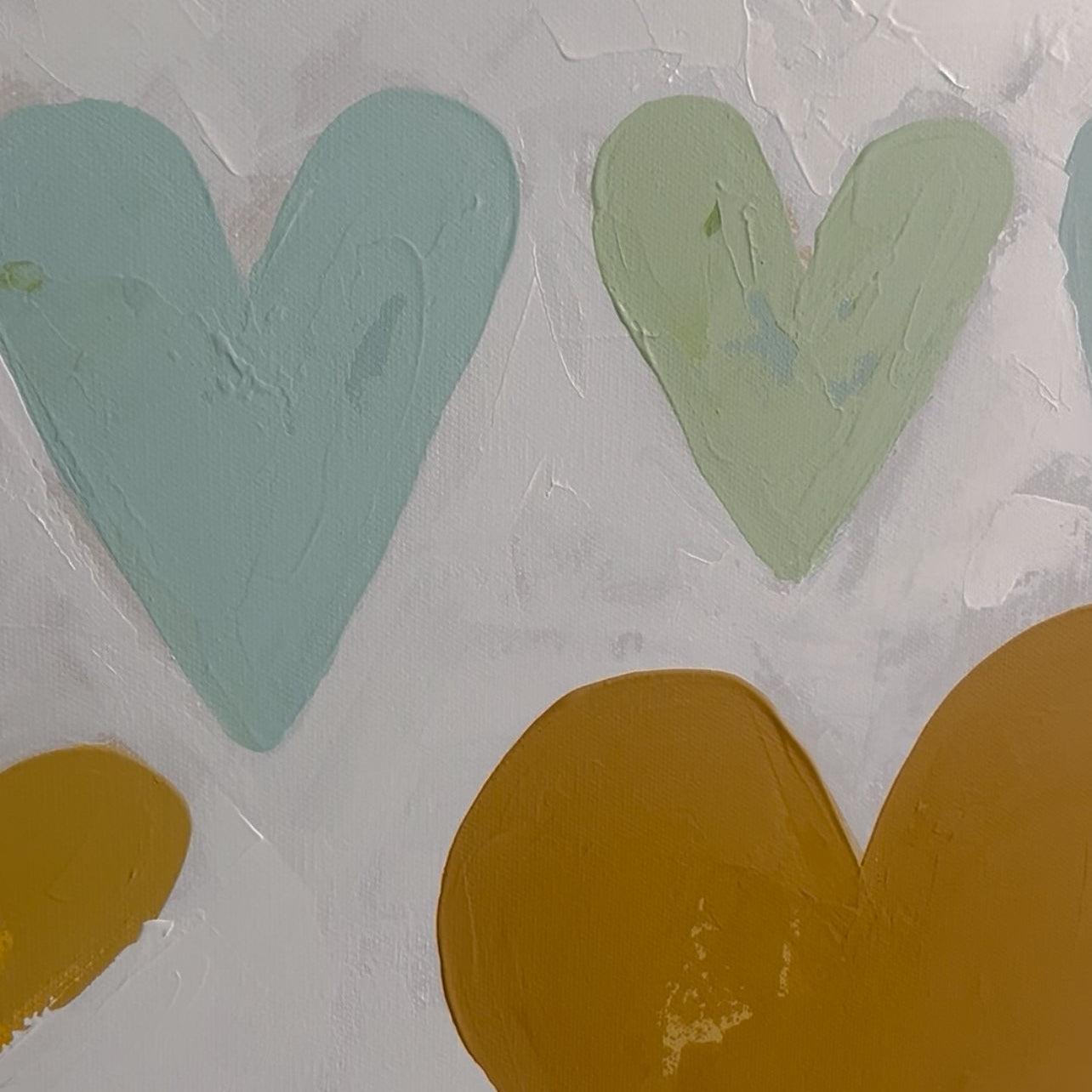 Colorful heart-shaped stamps on a textured surface