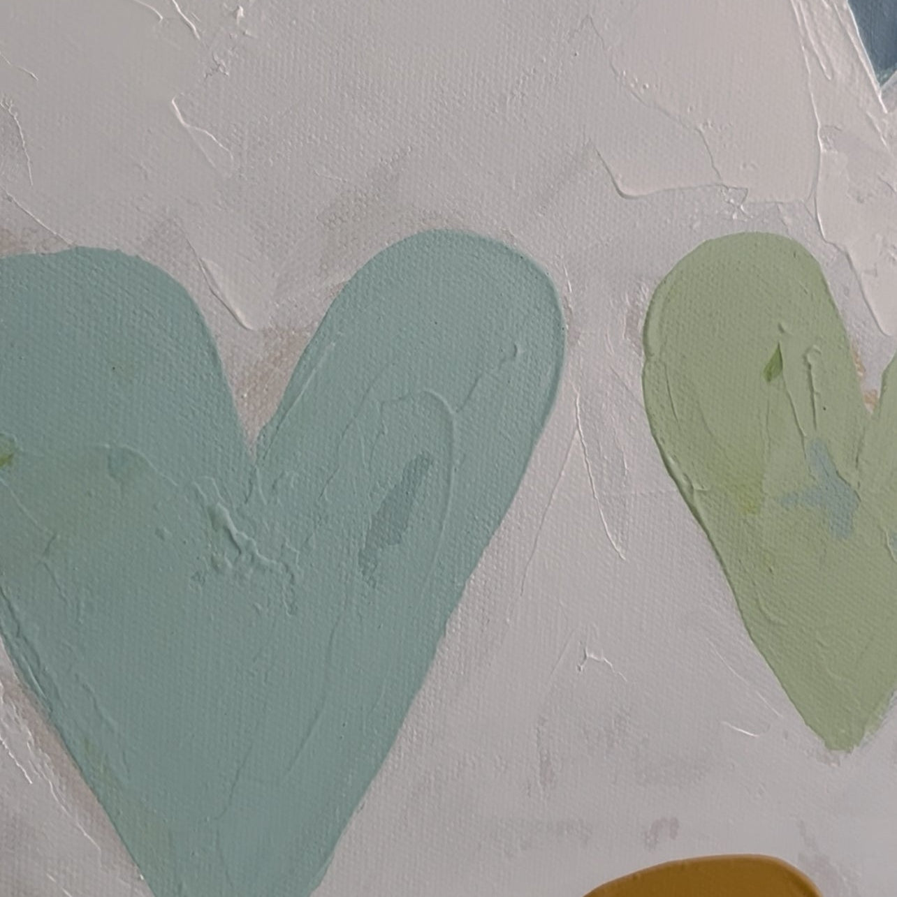 Close-up of abstract art with various colors on a textured surface