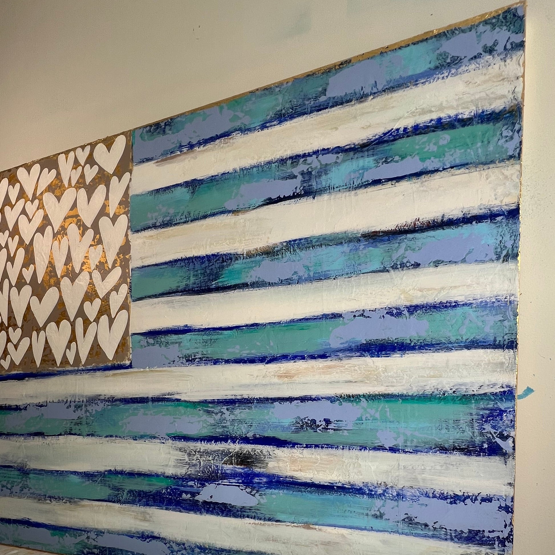 Ceiling with decorative paint patterns and a textured wall.