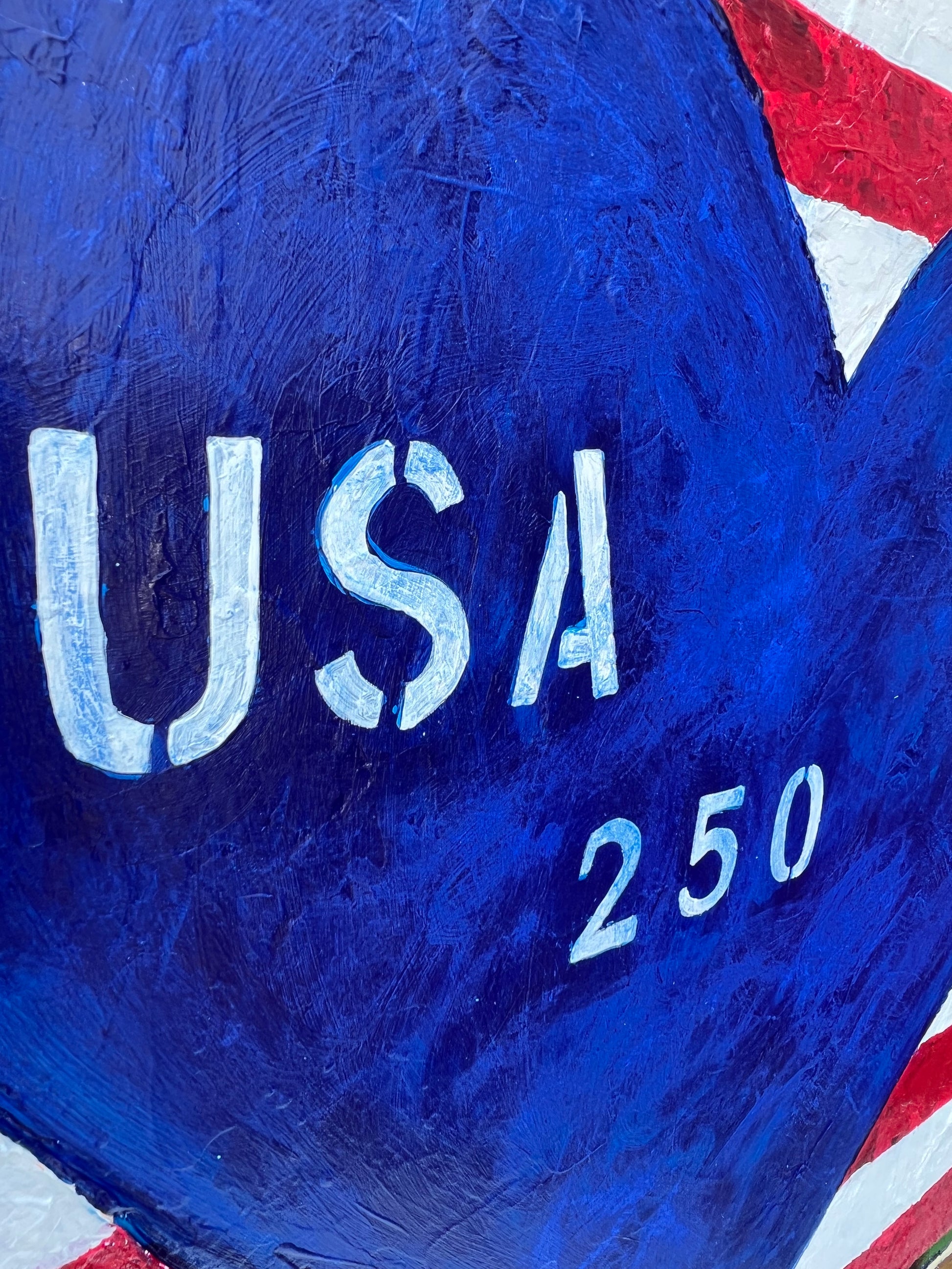 Blue object with 'USA 250' text on a red, white, and blue background