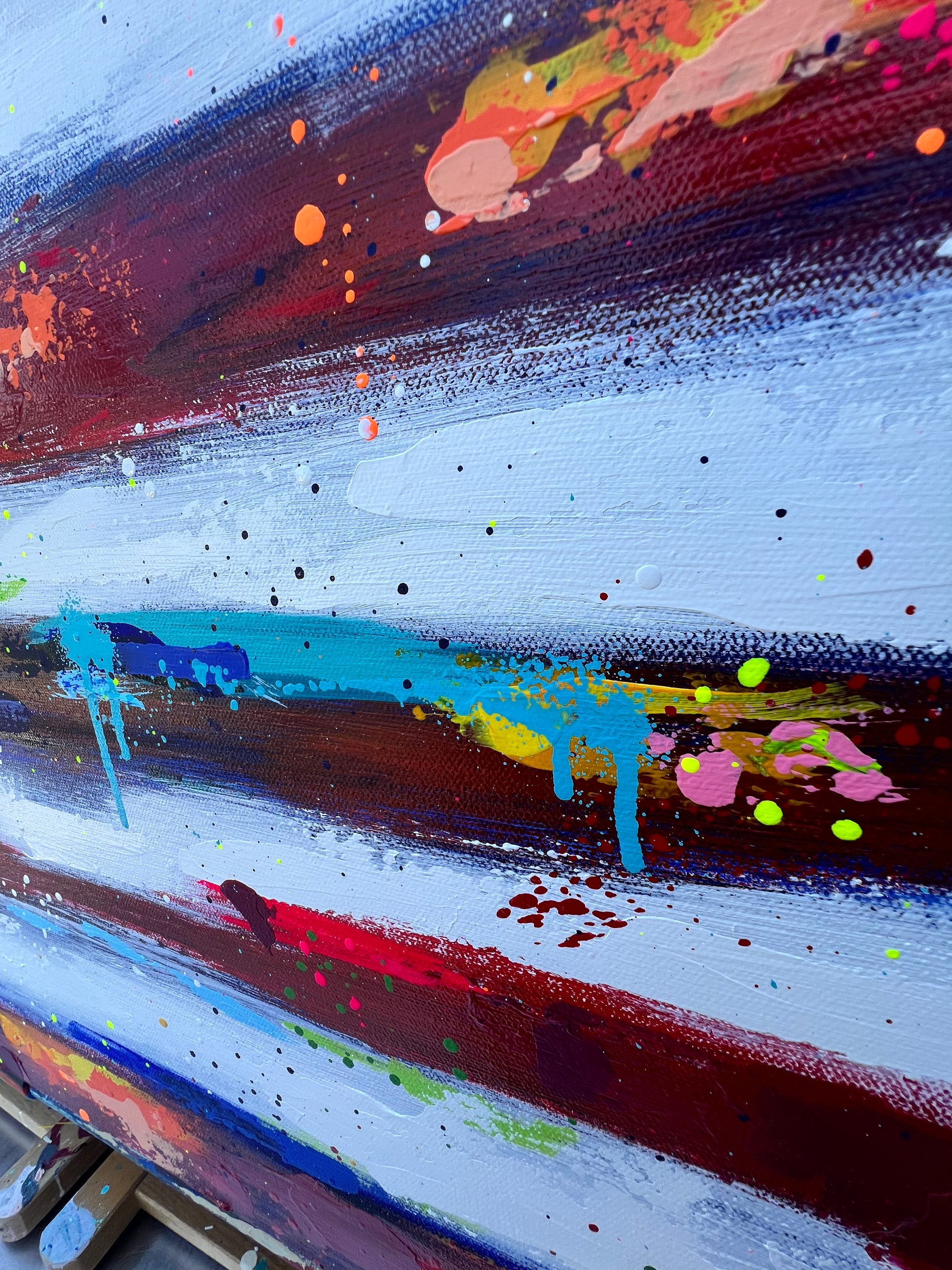 Abstract painting with splashes of color on a white background