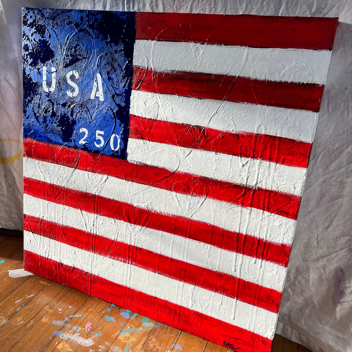 Artistic depiction of an American flag with 'USA 250' text on a textured surface.