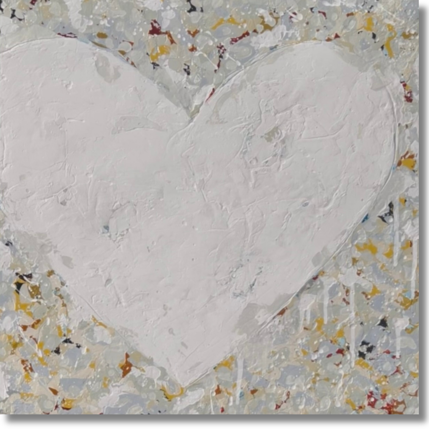 Heart-shaped artwork with textured surface and multicolored speckles on a gray background
